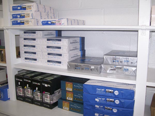 Office paper and printer supplies on the shelves